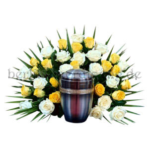 Freundliches Urnenhintergesteck aus weißen und gelben Rosen